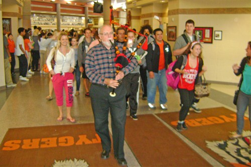 Bagpiper sends departing seniors on their way