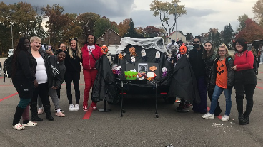 Adult Education and Cosmetology join together to pass out candy